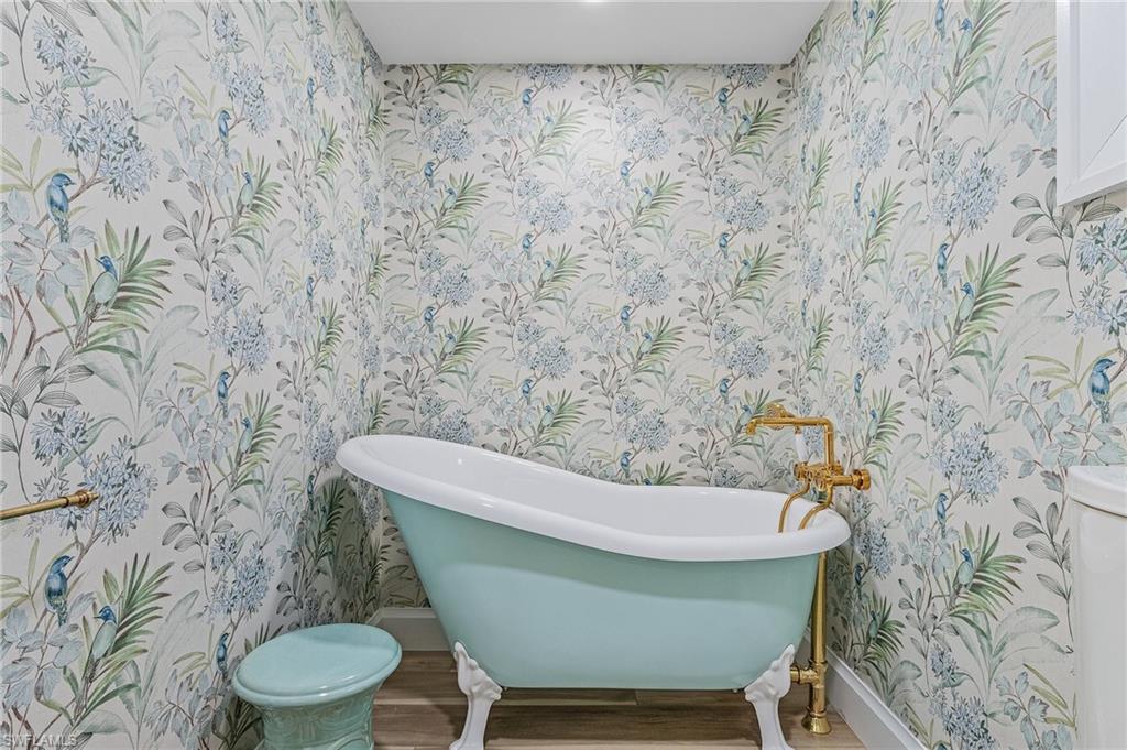 725 2nd Street South Naples, FL 34102 - Photo 13 of 21 a bathroom with a toilet and a sink