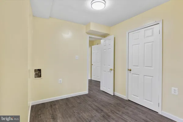 an empty room with wooden floor