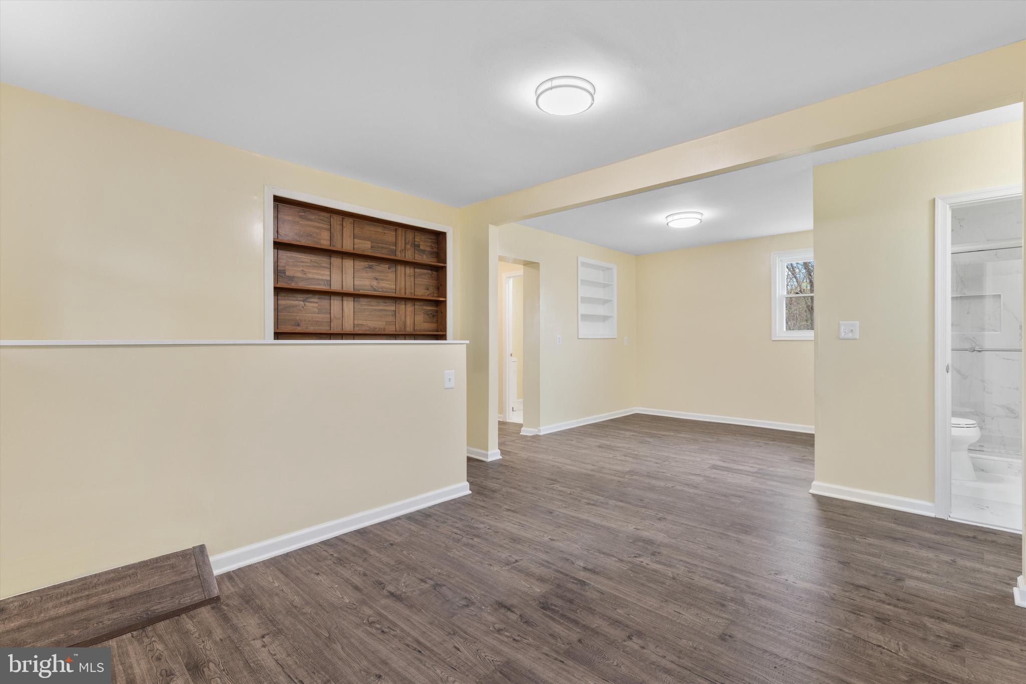 5662 Gunpowder Road White Marsh, MD 21162 - Photo 20 of 37 an empty room with wooden floor and windows