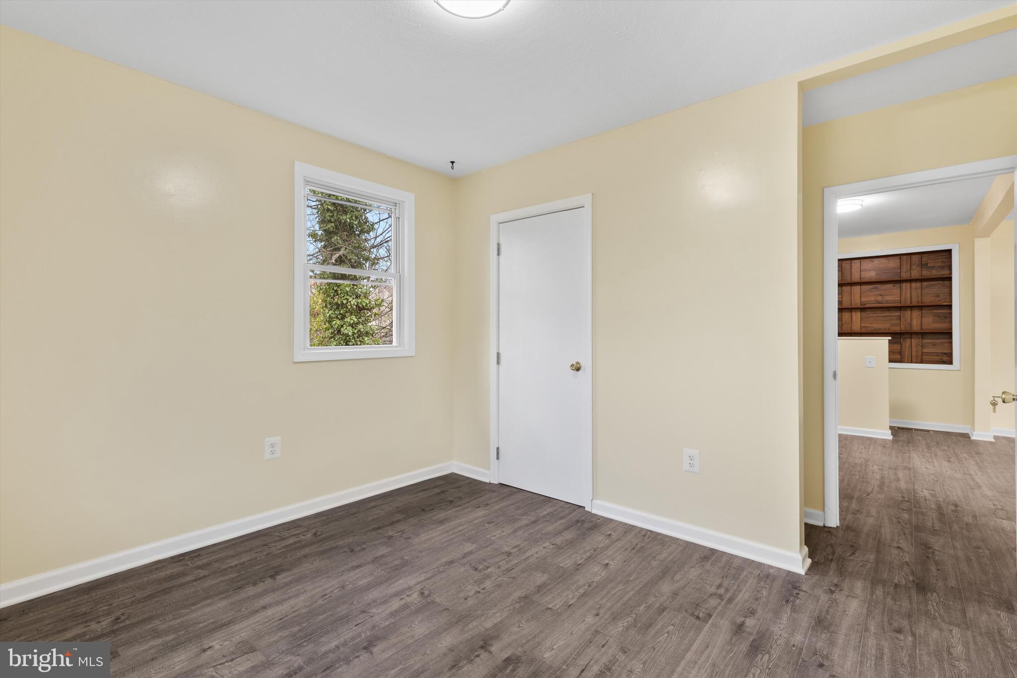 5662 Gunpowder Road White Marsh, MD 21162 - Photo 22 of 37 an empty room with wooden floor and windows