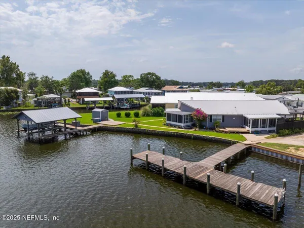 a view of a swimming pool with lounge chair
