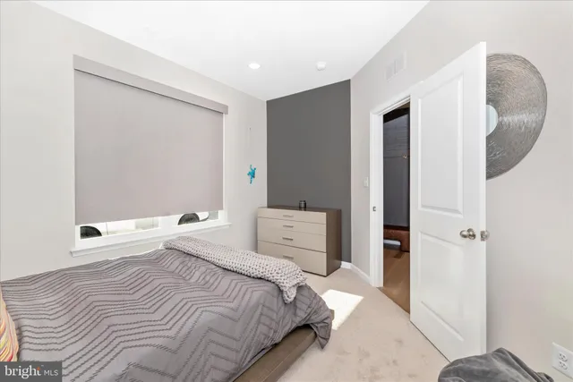 a dining room with furniture a chandelier and wooden floor