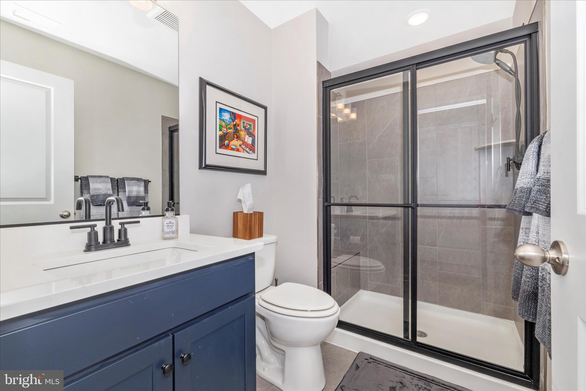 2502 Rucker Lane Frederick, MD 21701 - Photo 12 of 60 a bathroom with a sink toilet and shower