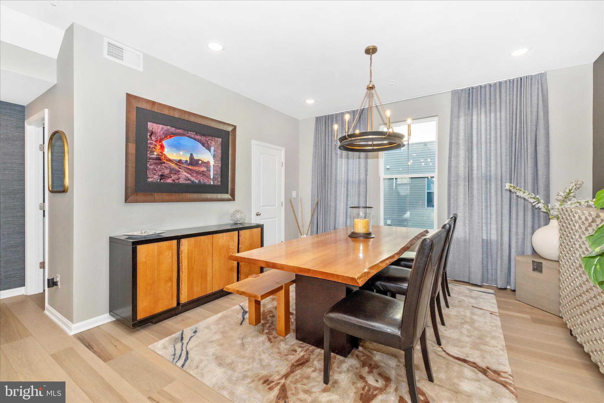 2502 Rucker Lane Frederick, MD 21701 - Photo 15 of 60 a view of a dining room with furniture window and wooden floor