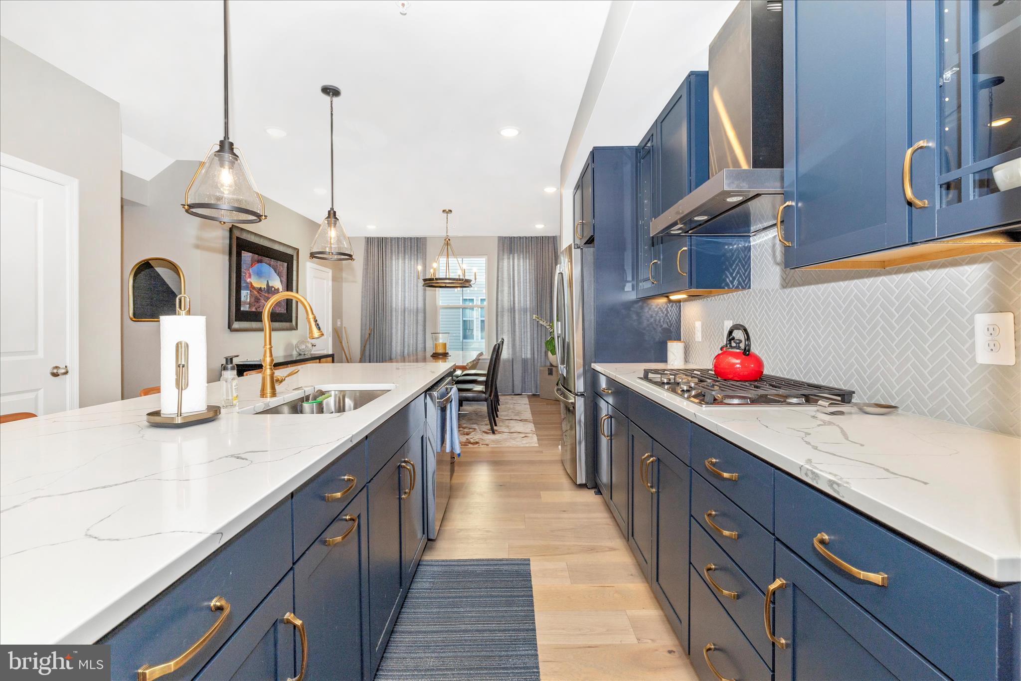 2502 Rucker Lane Frederick, MD 21701 - Photo 23 of 60 a kitchen with kitchen island granite countertop a sink and a stove