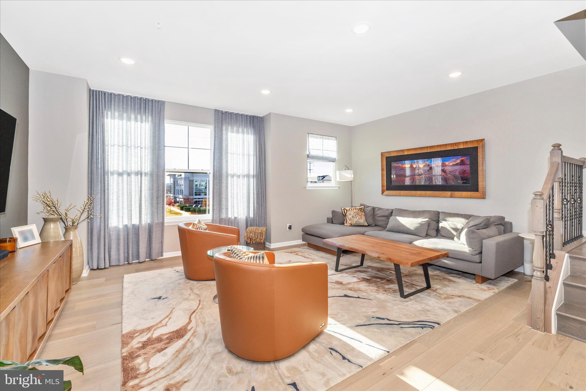 2502 Rucker Lane Frederick, MD 21701 - Photo 24 of 60 a living room with furniture large window and a flat screen tv