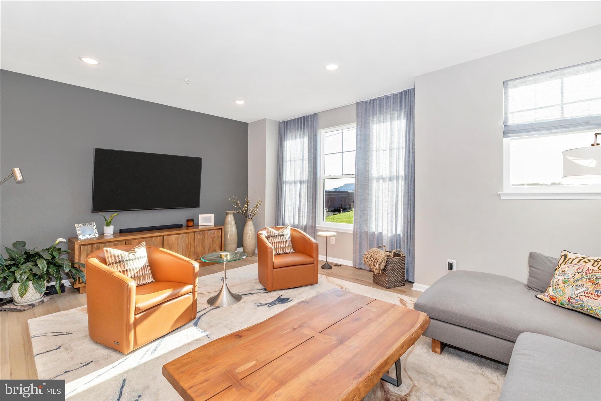2502 Rucker Lane Frederick, MD 21701 - Photo 26 of 60 a living room with furniture and a flat screen tv