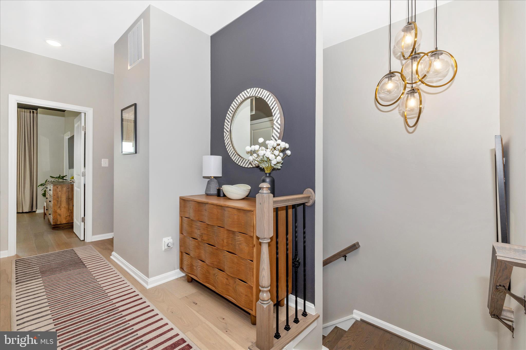 2502 Rucker Lane Frederick, MD 21701 - Photo 30 of 60 a view of a hallway with wooden floor