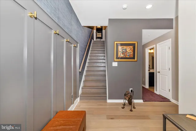 a view of a hallway with a large window and flowerpot