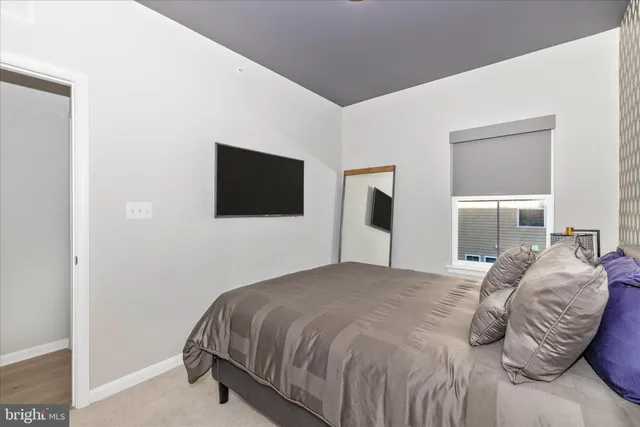 a bathroom with a sink a toilet and shower curtain