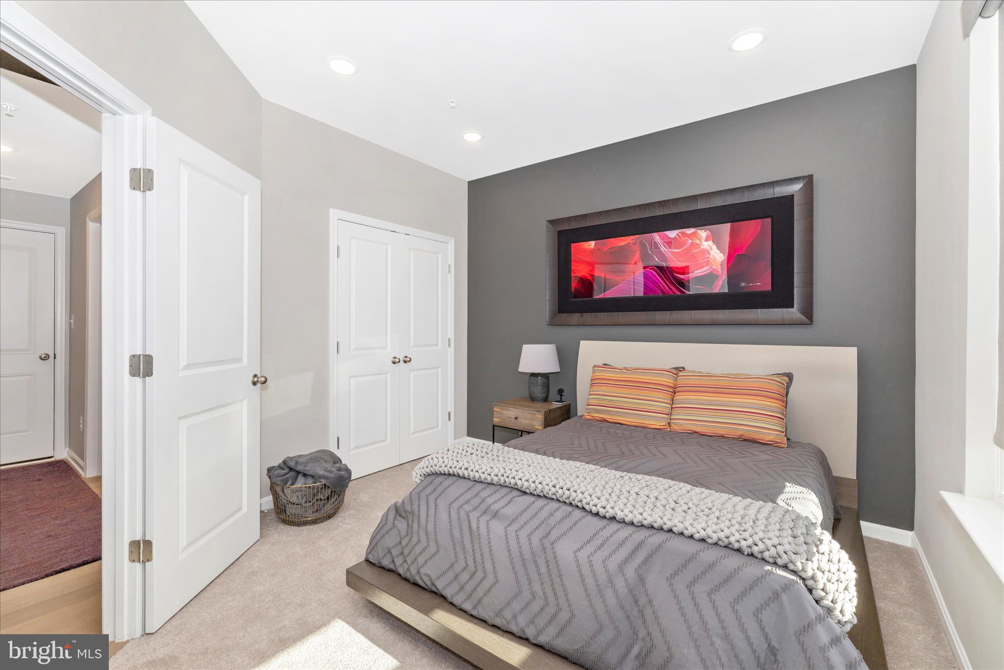 2502 Rucker Lane Frederick, MD 21701 - Photo 10 of 60 a bedroom with a bed and a flat screen tv