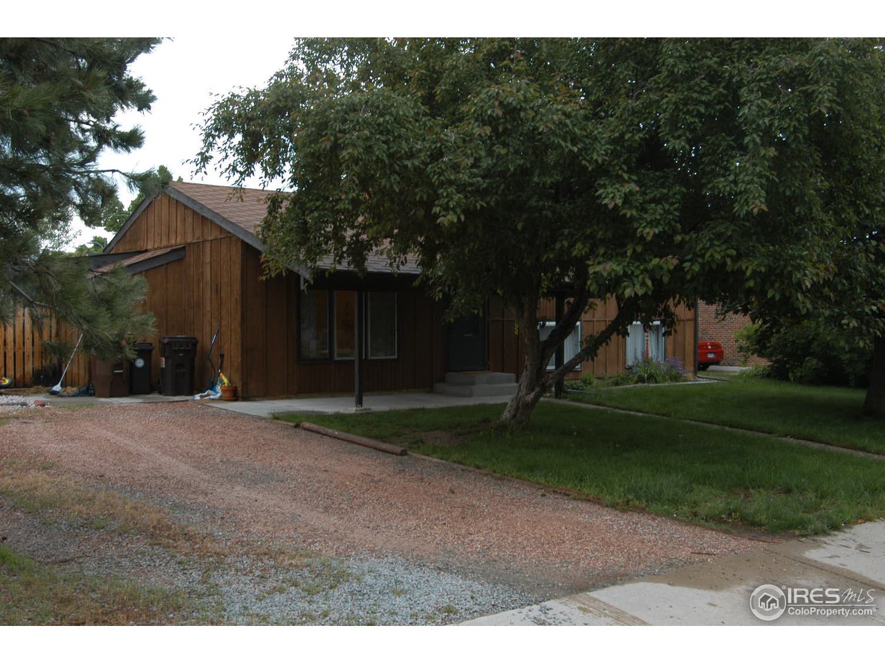 4655 Macky Way Boulder, CO 80305 - Photo 2 of 18 a backyard of a house with plants and trees