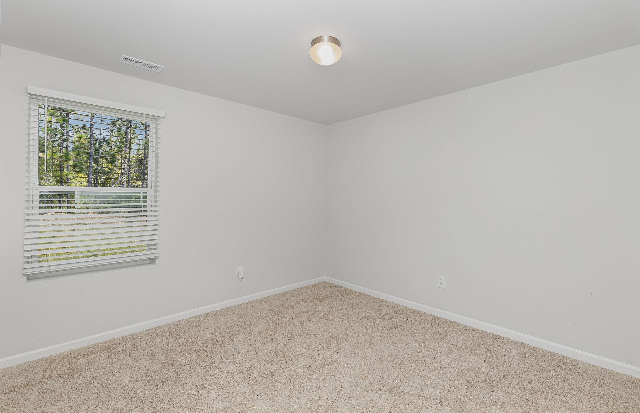 226 Hallow Oak Street Spring Lake, NC 28390 - Photo 13 of 30 an empty room with a window