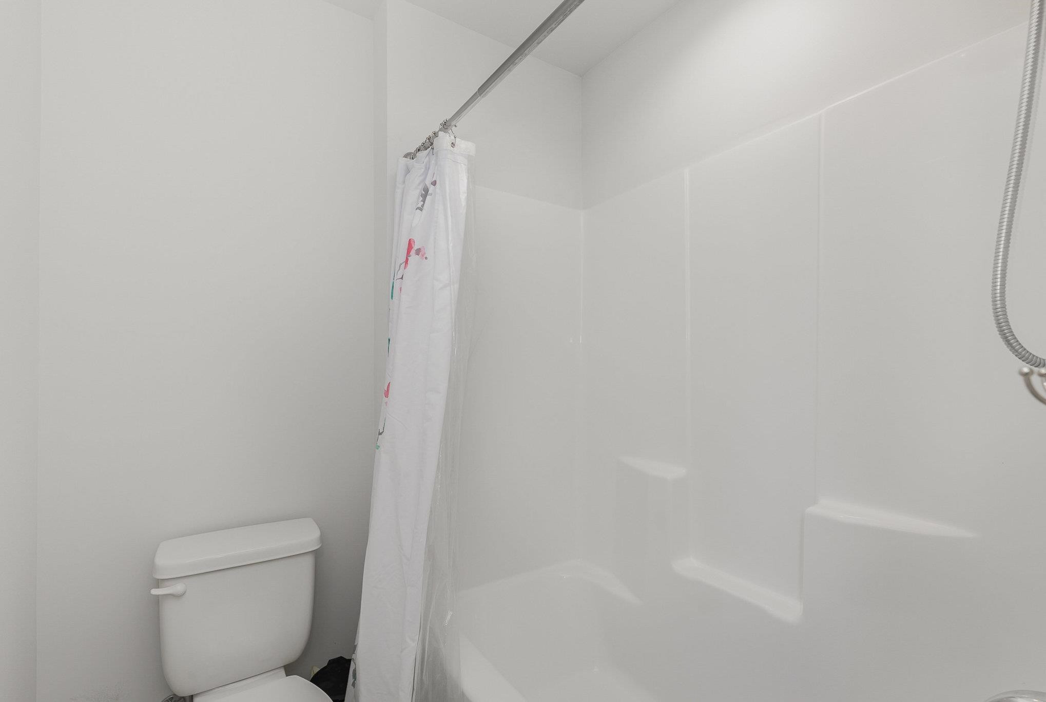 226 Hallow Oak Street Spring Lake, NC 28390 - Photo 14 of 30 a bathroom with a toilet and a shower