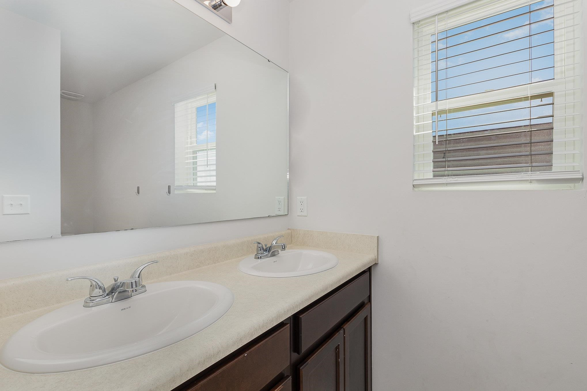 226 Hallow Oak Street Spring Lake, NC 28390 - Photo 15 of 30 a bathroom with a sink and a mirror