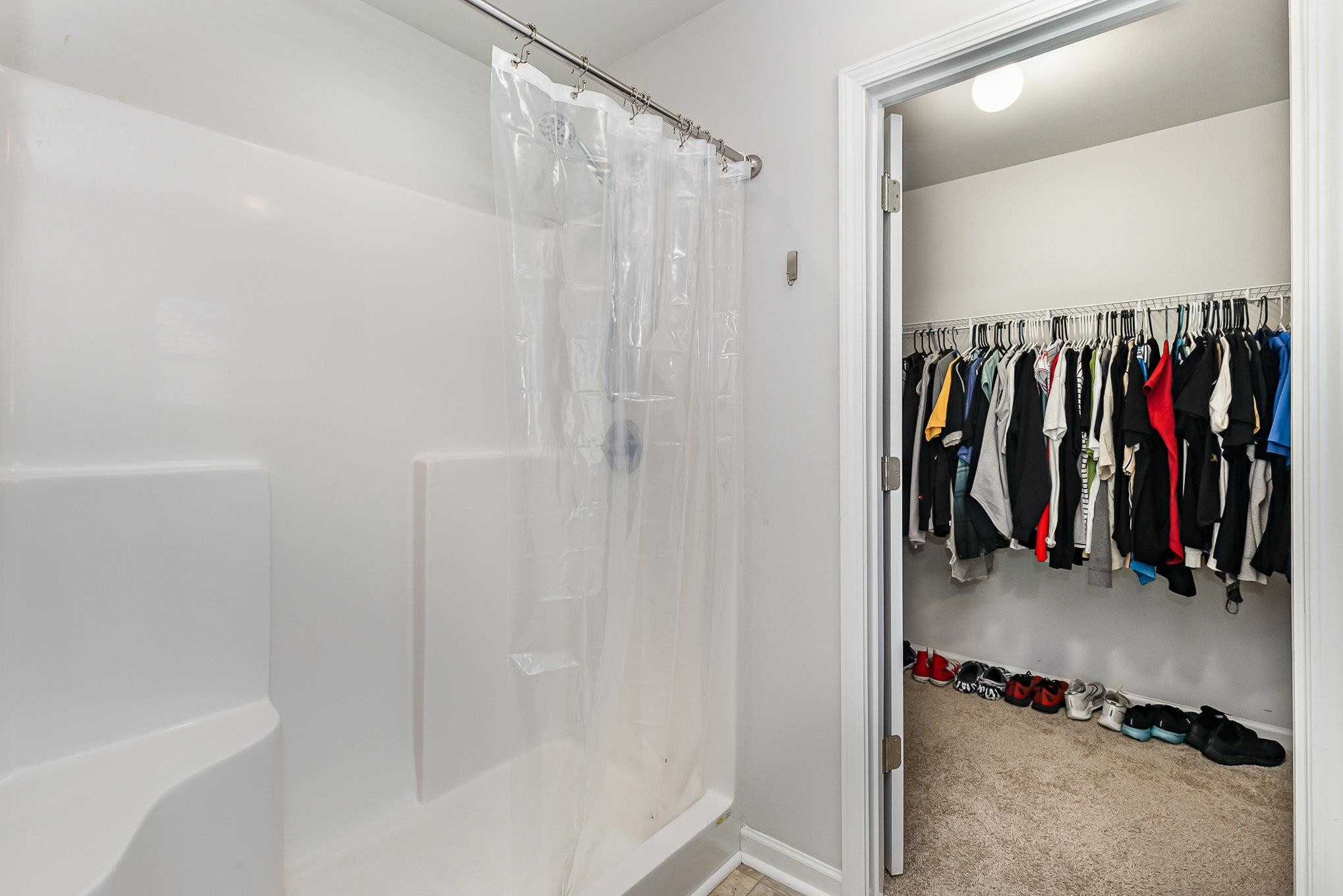 226 Hallow Oak Street Spring Lake, NC 28390 - Photo 16 of 30 a view of walk in closet with clothes