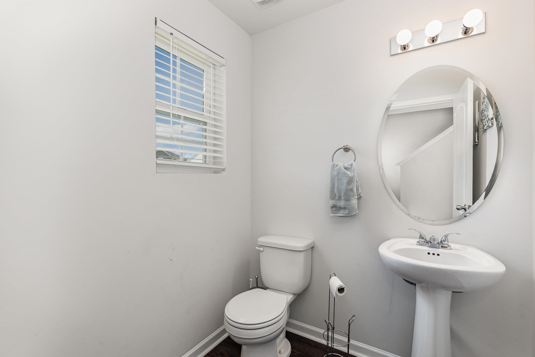 226 Hallow Oak Street Spring Lake, NC 28390 - Photo 22 of 30 a bathroom with a toilet sink and mirror