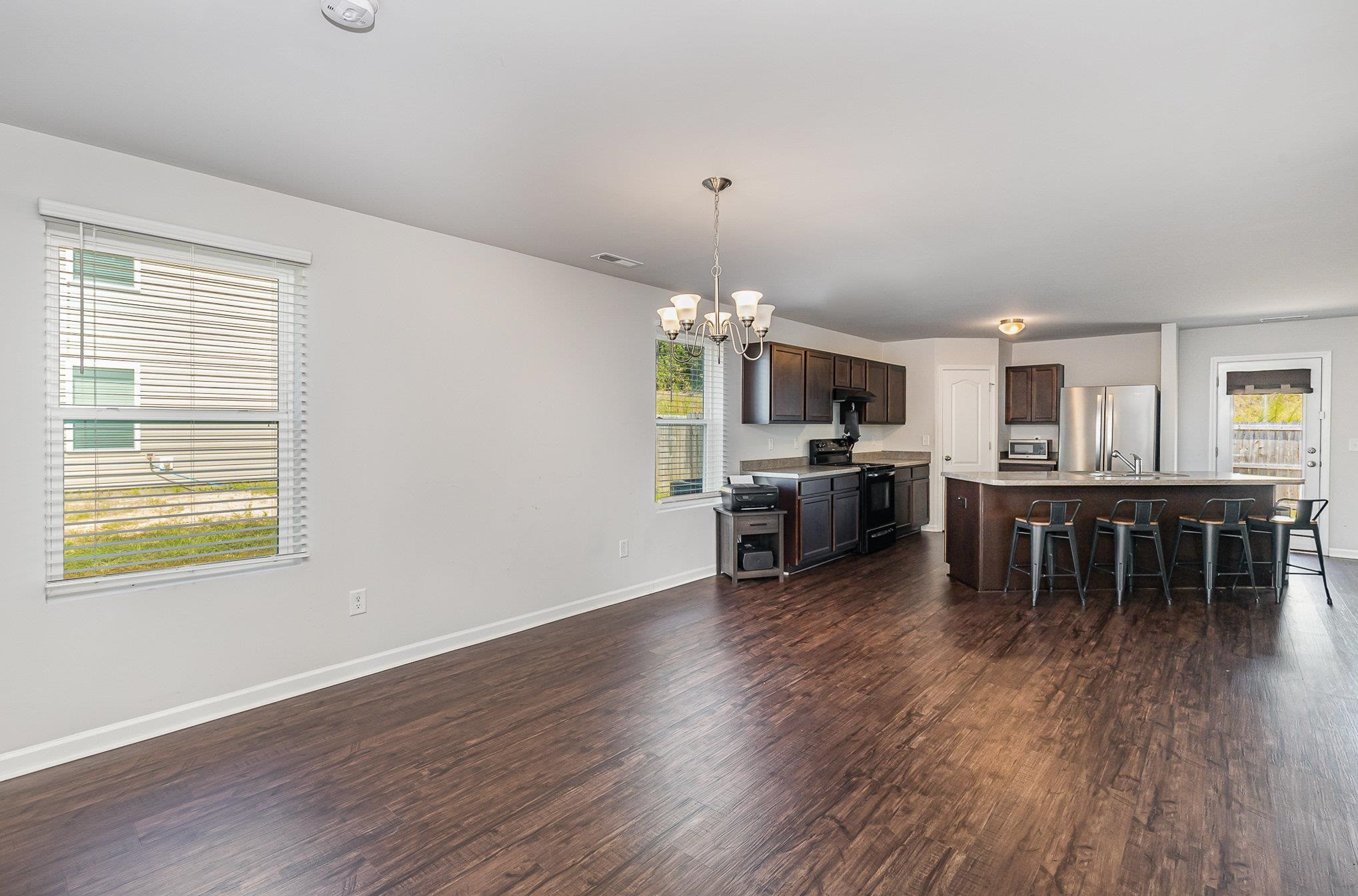 226 Hallow Oak Street Spring Lake, NC 28390 - Photo 28 of 30 a open kitchen with furniture and wooden floor