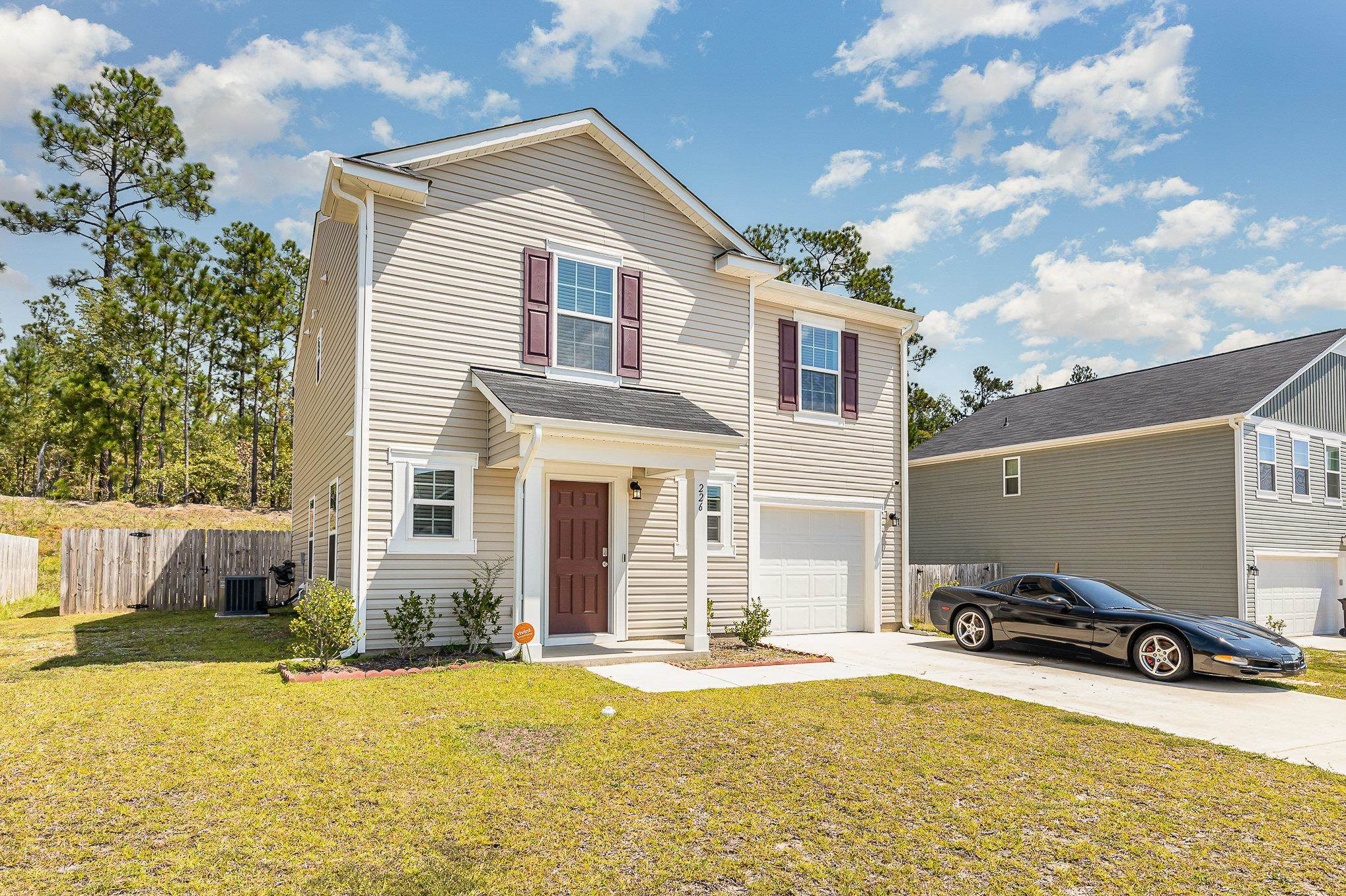 226 Hallow Oak Street Spring Lake, NC 28390 - Photo 3 of 30 a view of a house with pool and sitting area