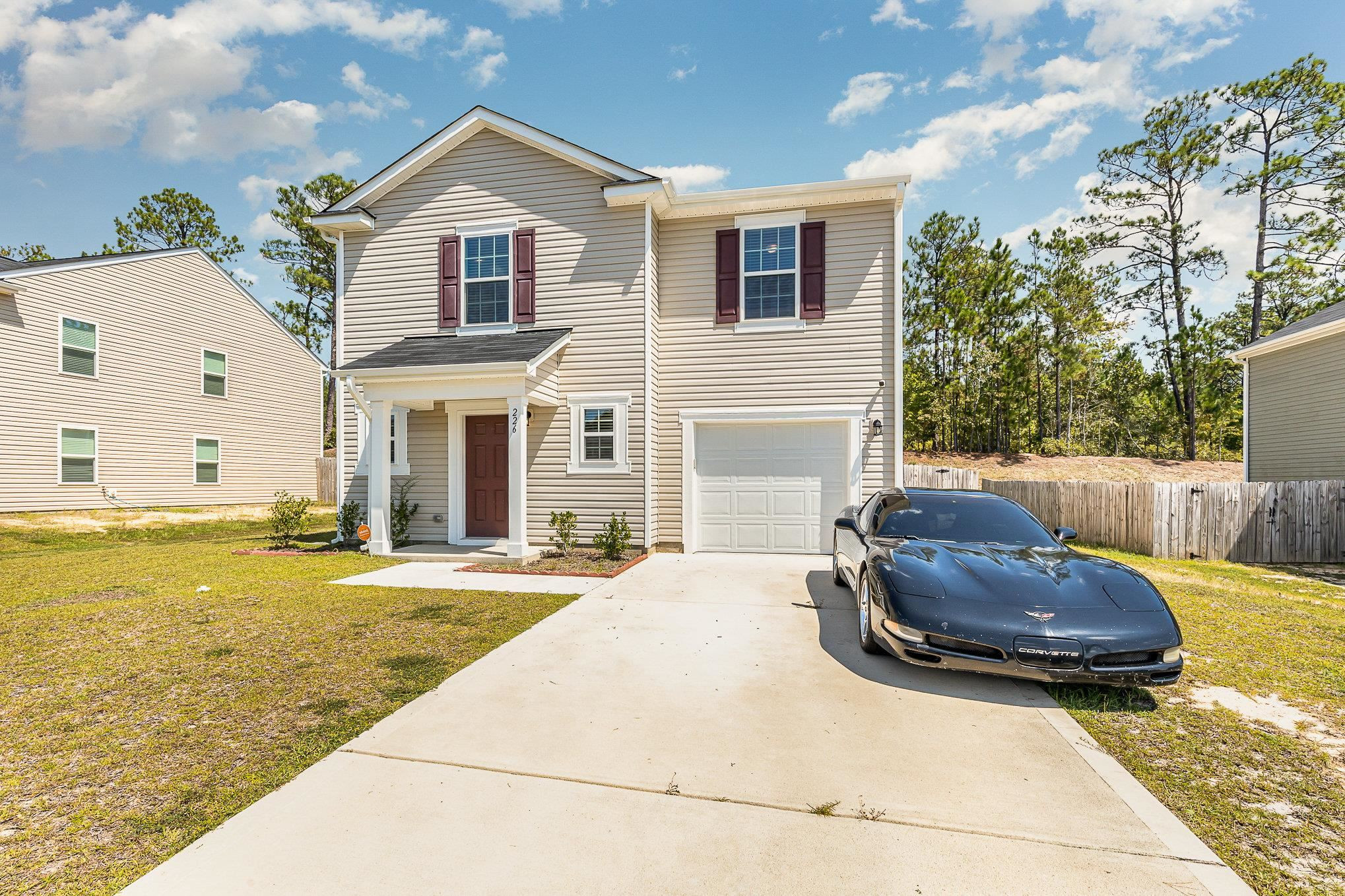 226 Hallow Oak Street Spring Lake, NC 28390 - Photo 5 of 30 a view of a house with backyard and sitting area