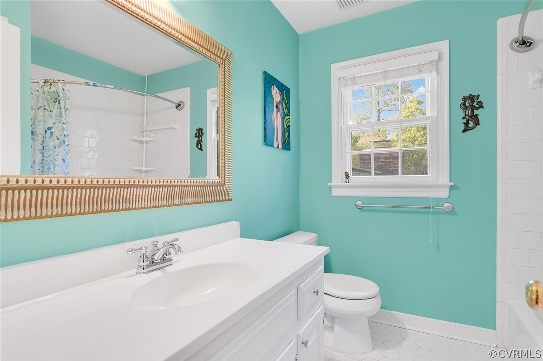 13724 Queensgate Road Midlothian, VA 23114 - Photo 26 of 48 a bathroom with a sink a toilet and a window
