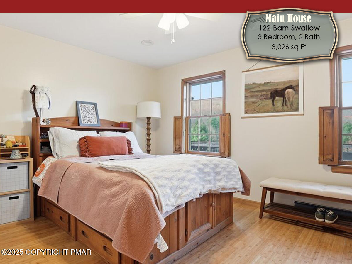 130 Barn Swallow Lane Cresco, PA 18326 - Photo 16 of 75 a bedroom with a bed and a desk