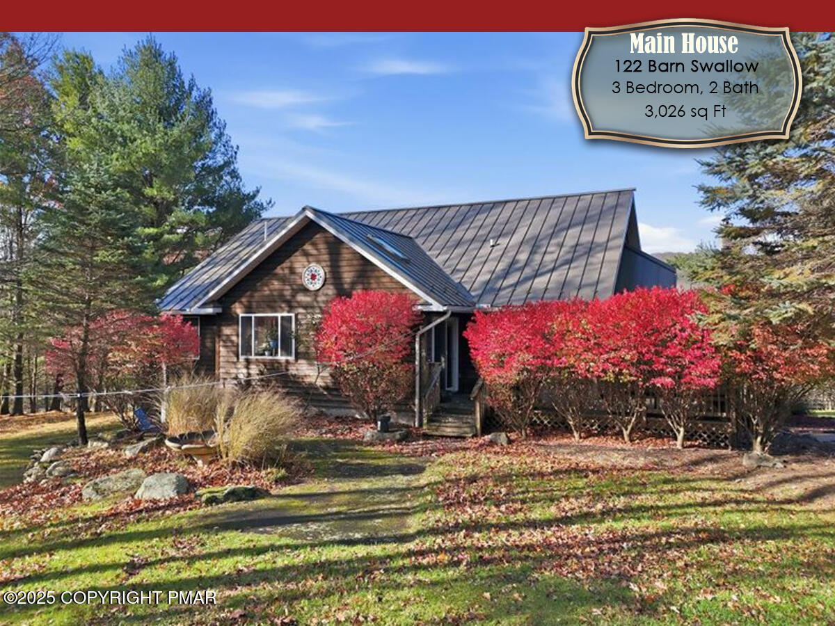 130 Barn Swallow Lane Cresco, PA 18326 - Photo 2 of 75 a front view of a house with garden