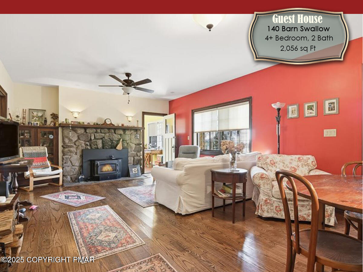 130 Barn Swallow Lane Cresco, PA 18326 - Photo 30 of 75 a living room with furniture a fireplace and a table