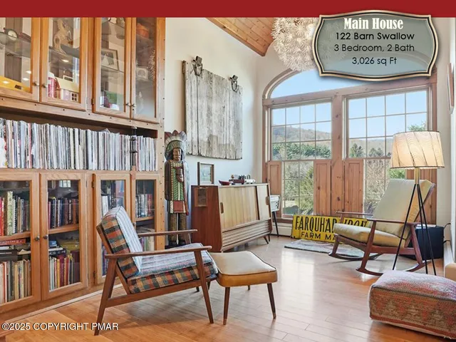a view of a living room and patio area