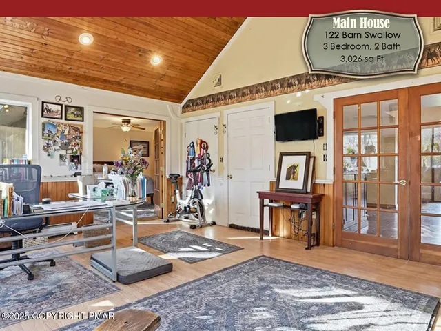 a kitchen with stainless steel appliances granite countertop a refrigerator a sink dishwasher a stove and white cabinets