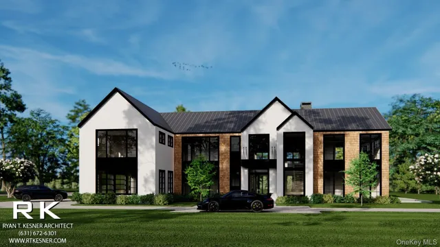 a front view of a house with a yard and trees