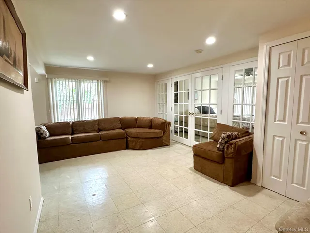 a living room with furniture window and glass door