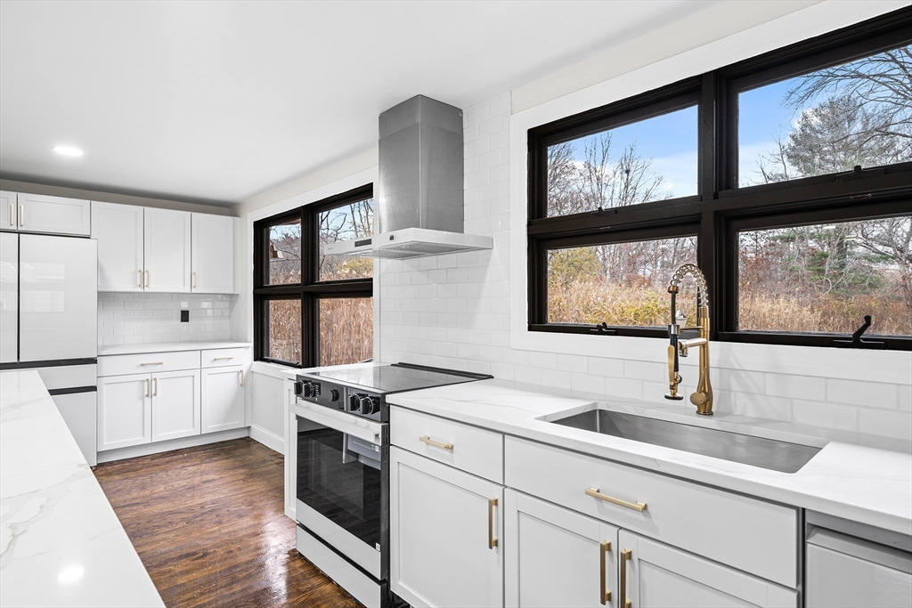 195 Barney Avenue Rehoboth, MA 02769 - Photo 11 of 37 a kitchen that has a sink and a stove