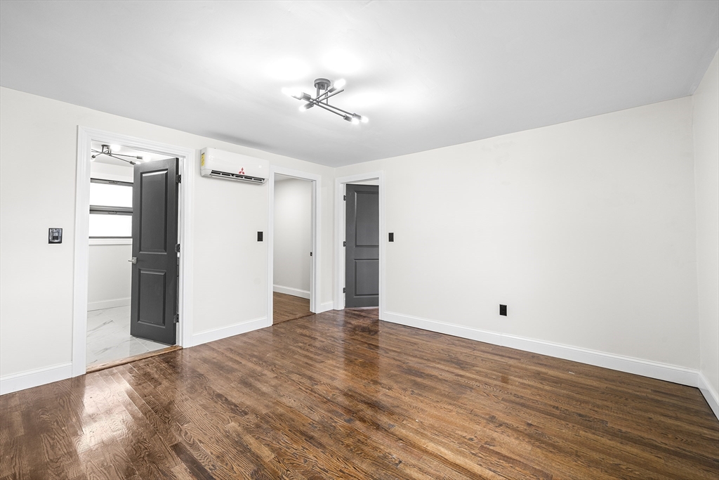 195 Barney Avenue Rehoboth, MA 02769 - Photo 22 of 37 a view of an empty room with wooden floor