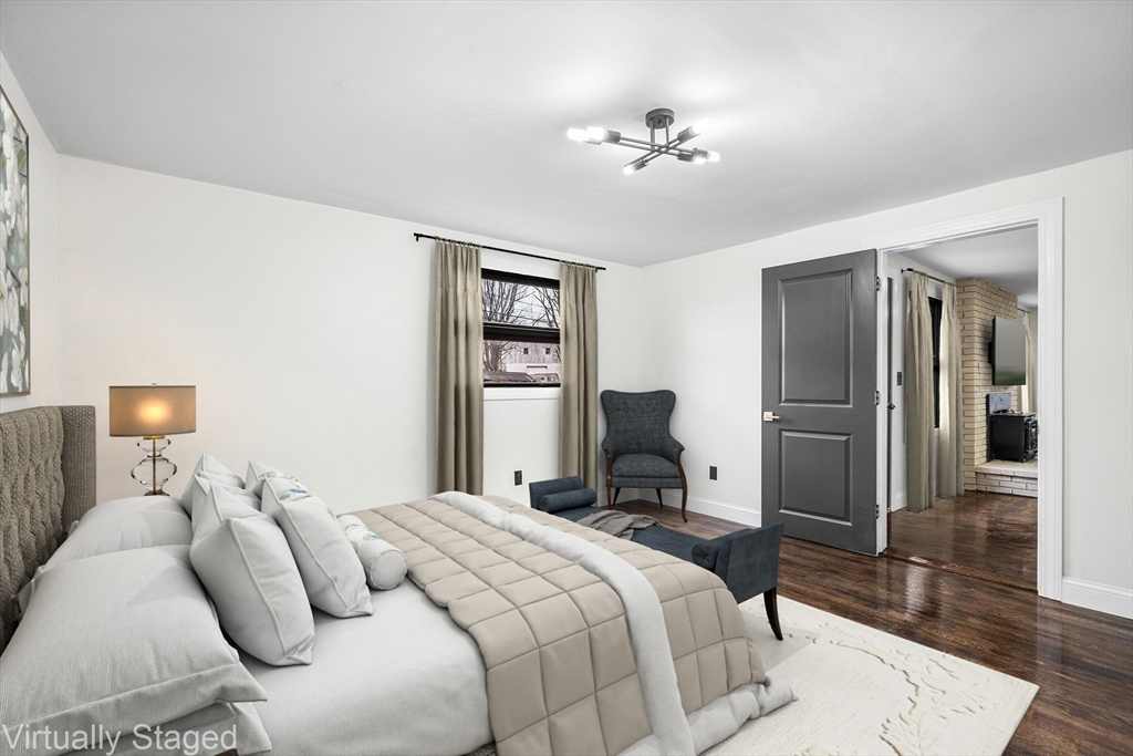 195 Barney Avenue Rehoboth, MA 02769 - Photo 23 of 37 a bedroom with a bed and a chandelier