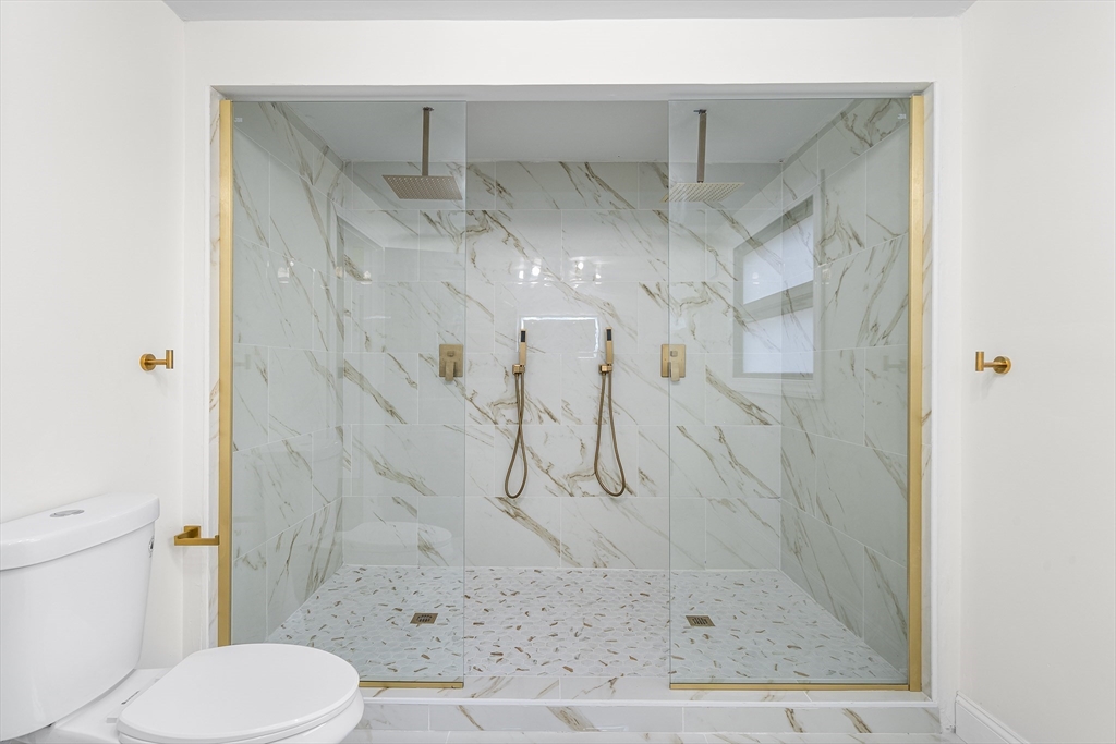 195 Barney Avenue Rehoboth, MA 02769 - Photo 28 of 37 a bathroom with a shower and toilet