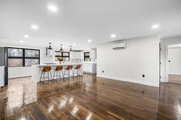 a view of kitchen with furniture and wooden floor