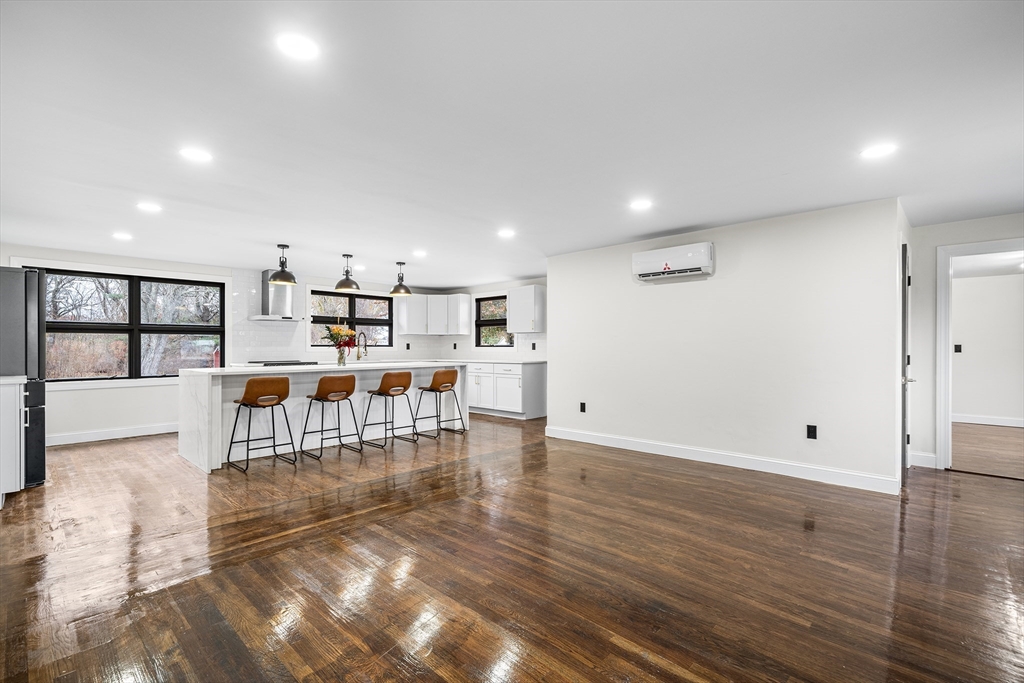 195 Barney Avenue Rehoboth, MA 02769 - Photo 4 of 37 a view of kitchen with furniture and wooden floor