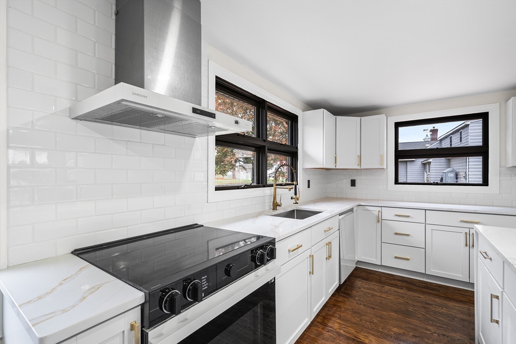 195 Barney Avenue Rehoboth, MA 02769 - Photo 8 of 37 a kitchen with a stove cabinets and a window