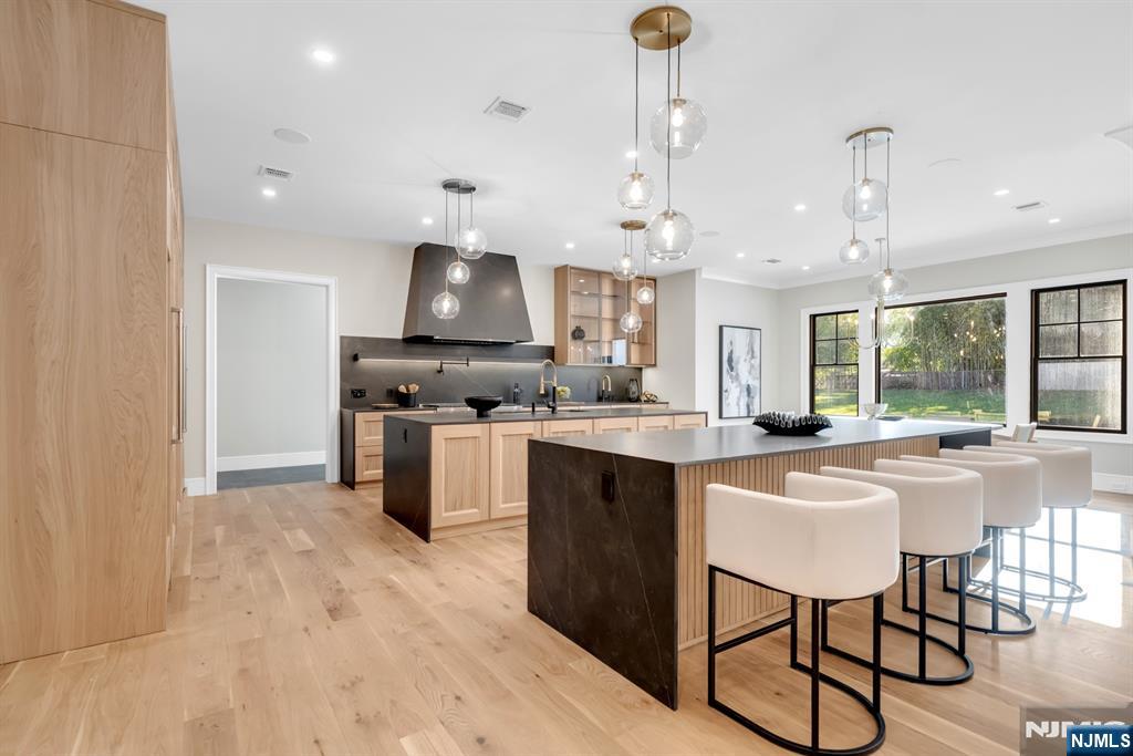 12 Echo Ridge Road Upper Saddle River, NJ 07458 - Photo 14 of 49 a kitchen with stainless steel appliances granite countertop a sink a stove and a refrigerator