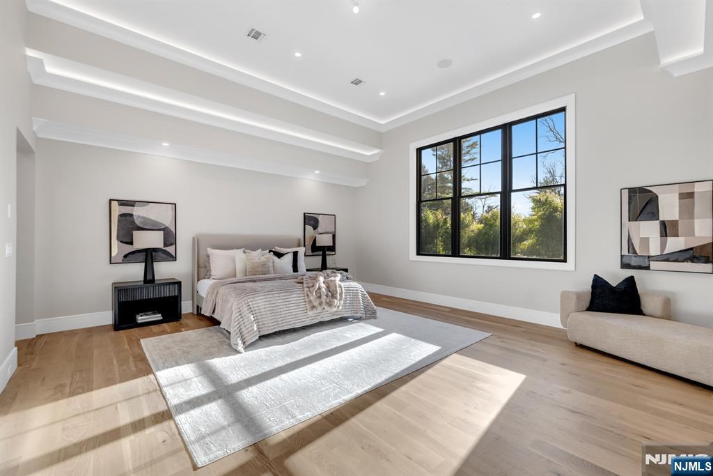 12 Echo Ridge Road Upper Saddle River, NJ 07458 - Photo 24 of 49 a spacious bedroom with a large bed and a couch