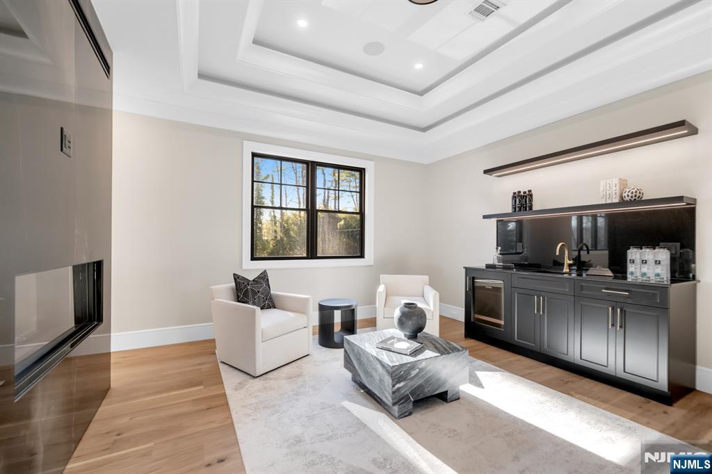 12 Echo Ridge Road Upper Saddle River, NJ 07458 - Photo 26 of 49 a living room with furniture and a flat screen tv