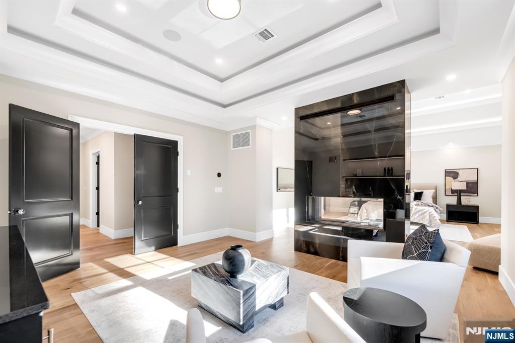 12 Echo Ridge Road Upper Saddle River, NJ 07458 - Photo 27 of 49 a living room with furniture and a flat screen tv