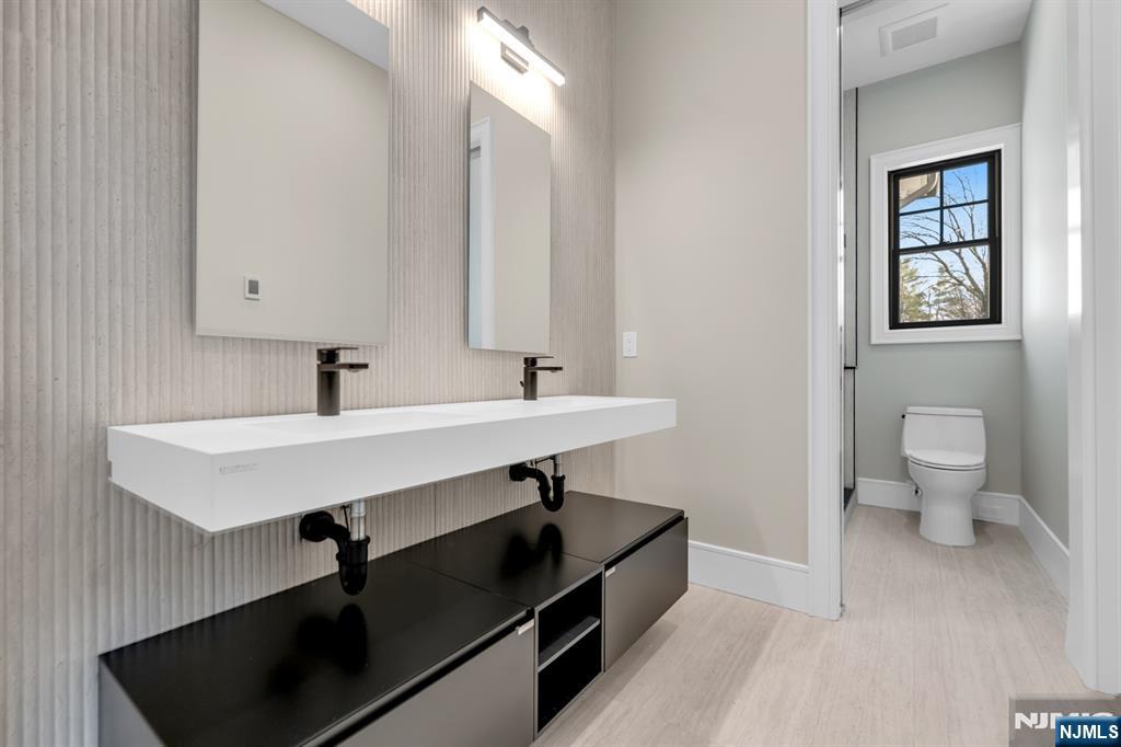 12 Echo Ridge Road Upper Saddle River, NJ 07458 - Photo 35 of 49 a bathroom with a sink and a toilet