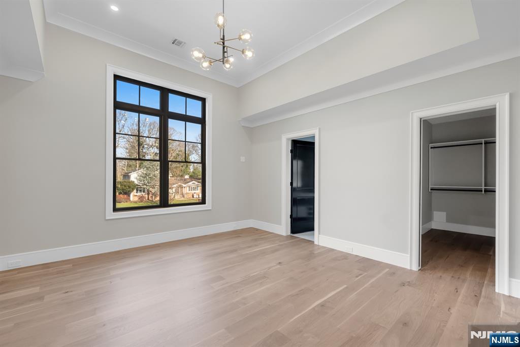 12 Echo Ridge Road Upper Saddle River, NJ 07458 - Photo 36 of 49 a view of an empty room with a window and wooden floor