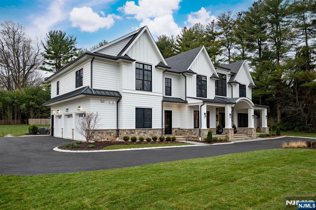 12 Echo Ridge Road Upper Saddle River, NJ 07458 - Photo 4 of 49 a front view of a house with a yard