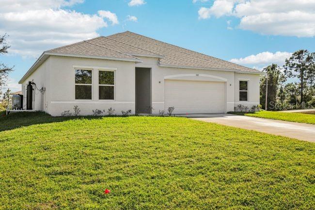 16492 Crane Road Weeki Wachee, FL 34614 - Photo 3 of 24 a front view of house with yard and green space