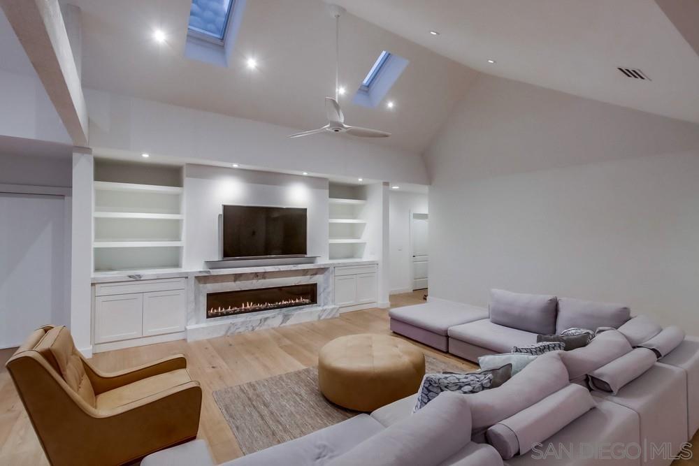 4124 Stonebridge Lane Rancho Santa Fe, CA 92091 - Photo 15 of 38 a living room with furniture and a flat screen tv