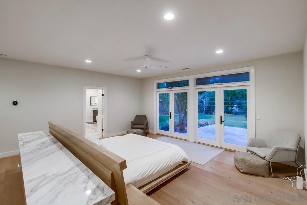 4124 Stonebridge Lane Rancho Santa Fe, CA 92091 - Photo 17 of 38 a bed room with a bed and a chair