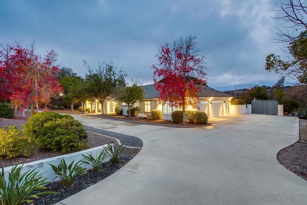 4124 Stonebridge Lane Rancho Santa Fe, CA 92091 - Photo 2 of 38 a view of a house with a street